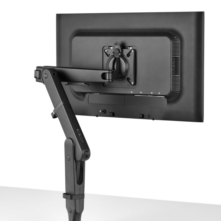 Black Herman Miller monitor arm shown with a monitor